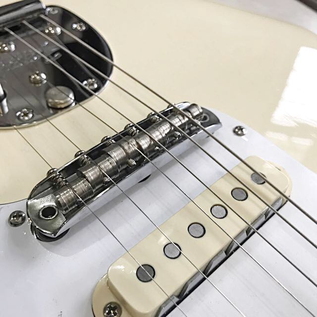 Mustang Guitar Bridge on white offset guitar